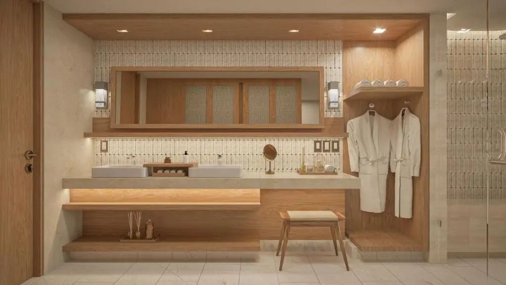 Großer Waschtisch im Badezimmer mit breitem Spiegel, zwei Waschbecken und Bademantel.