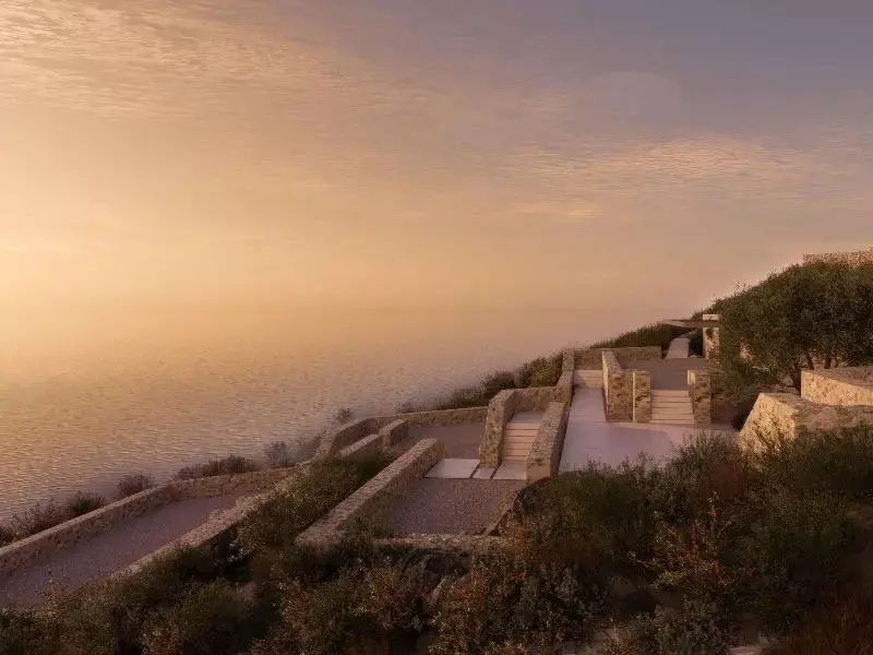 Terrassenförmig angelegte Steinwege an einer Steilküste mit Blick auf den Ozean.