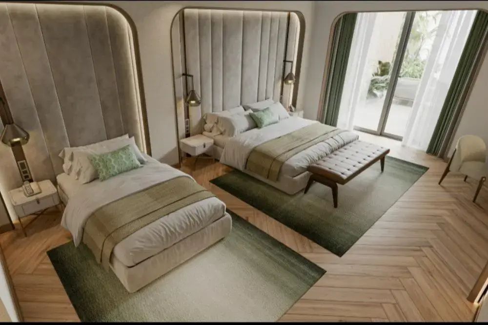 Schlafzimmer mit Doppelbett, Einzelbett, Teppichen und gepolstertem Kopfteil.