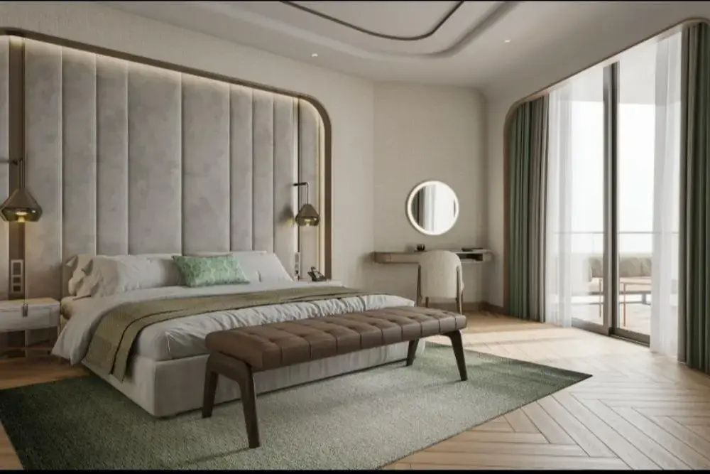 Modernes Hotelzimmer mit großem Doppelbett, Polsterbank und Schminktisch.