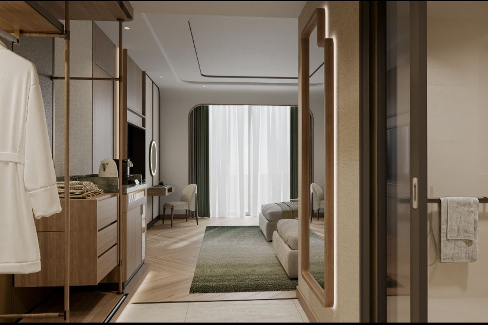 Eingangsbereich eines Hotelzimmers mit Spiegel, Einbauschränken und Sitzgelegenheit.