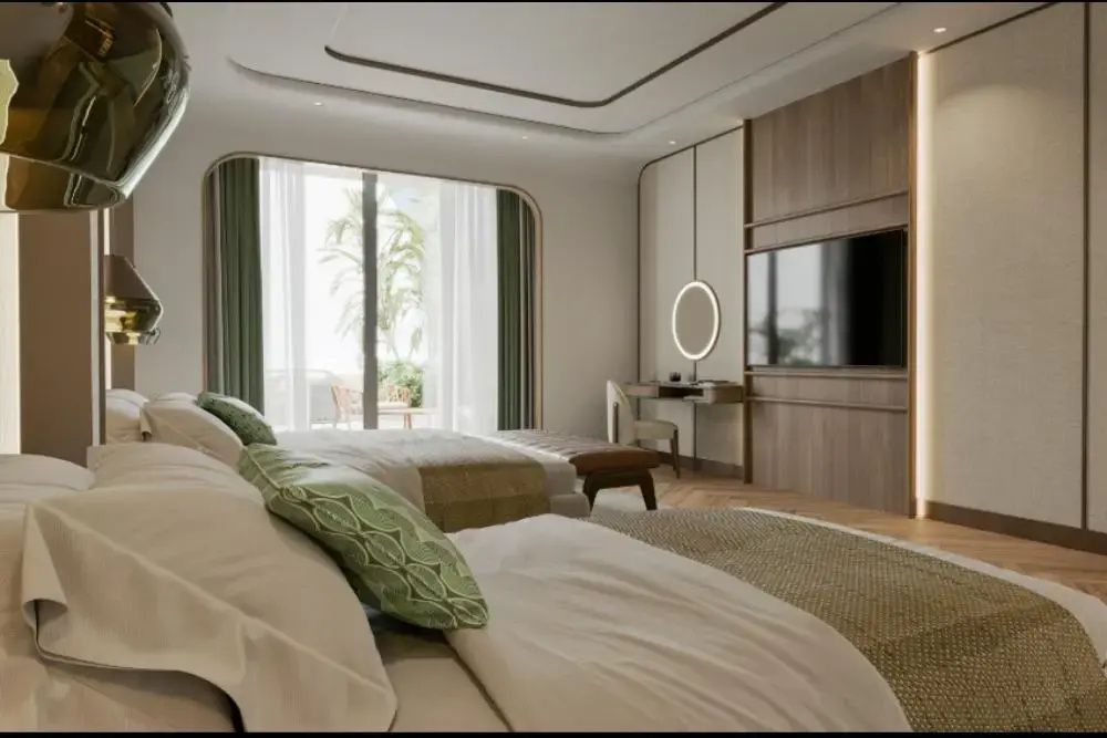 Blick auf Fernseher, Schminktisch mit rundem Spiegel und Balkontür im Zimmer.