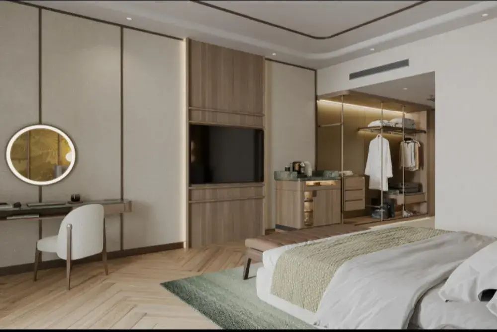 Modernes Hotelzimmer mit Flachbild-TV, Parkettboden und offenem Ankleidebereich.