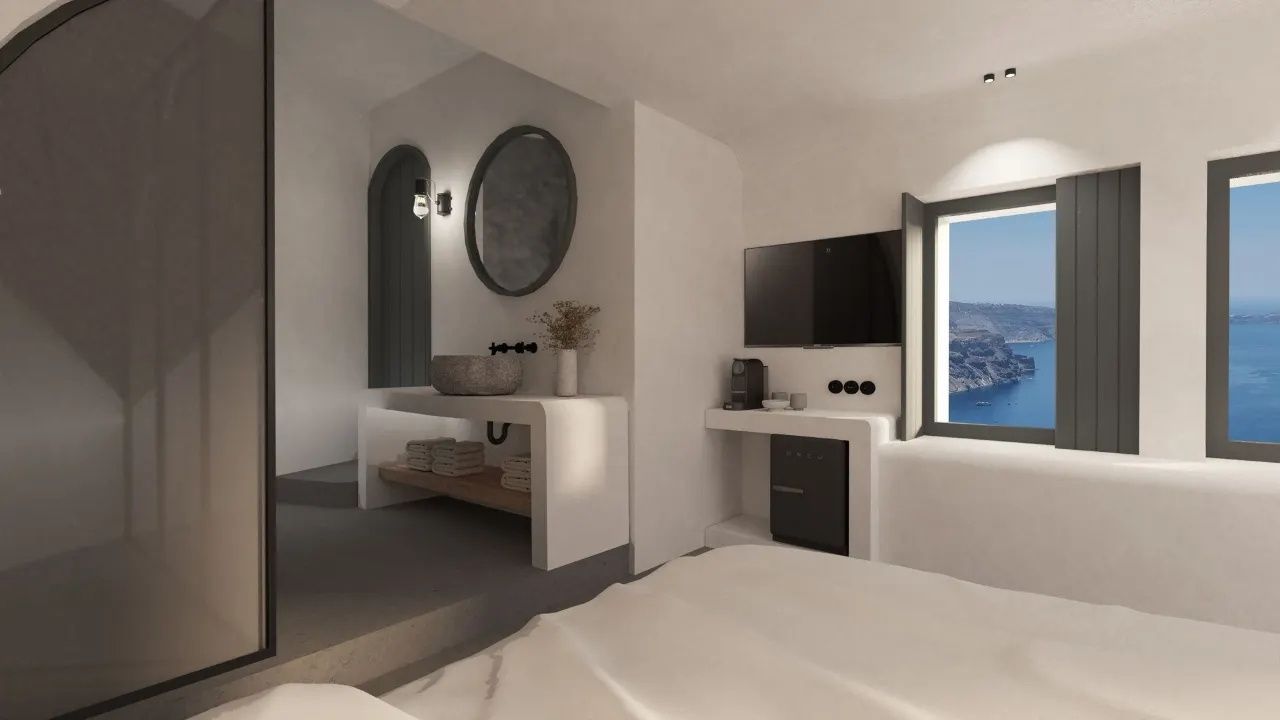 Weiß gestaltetes Zimmer mit Fernseher, Minikühlschrank, Waschtisch und Meerblick.